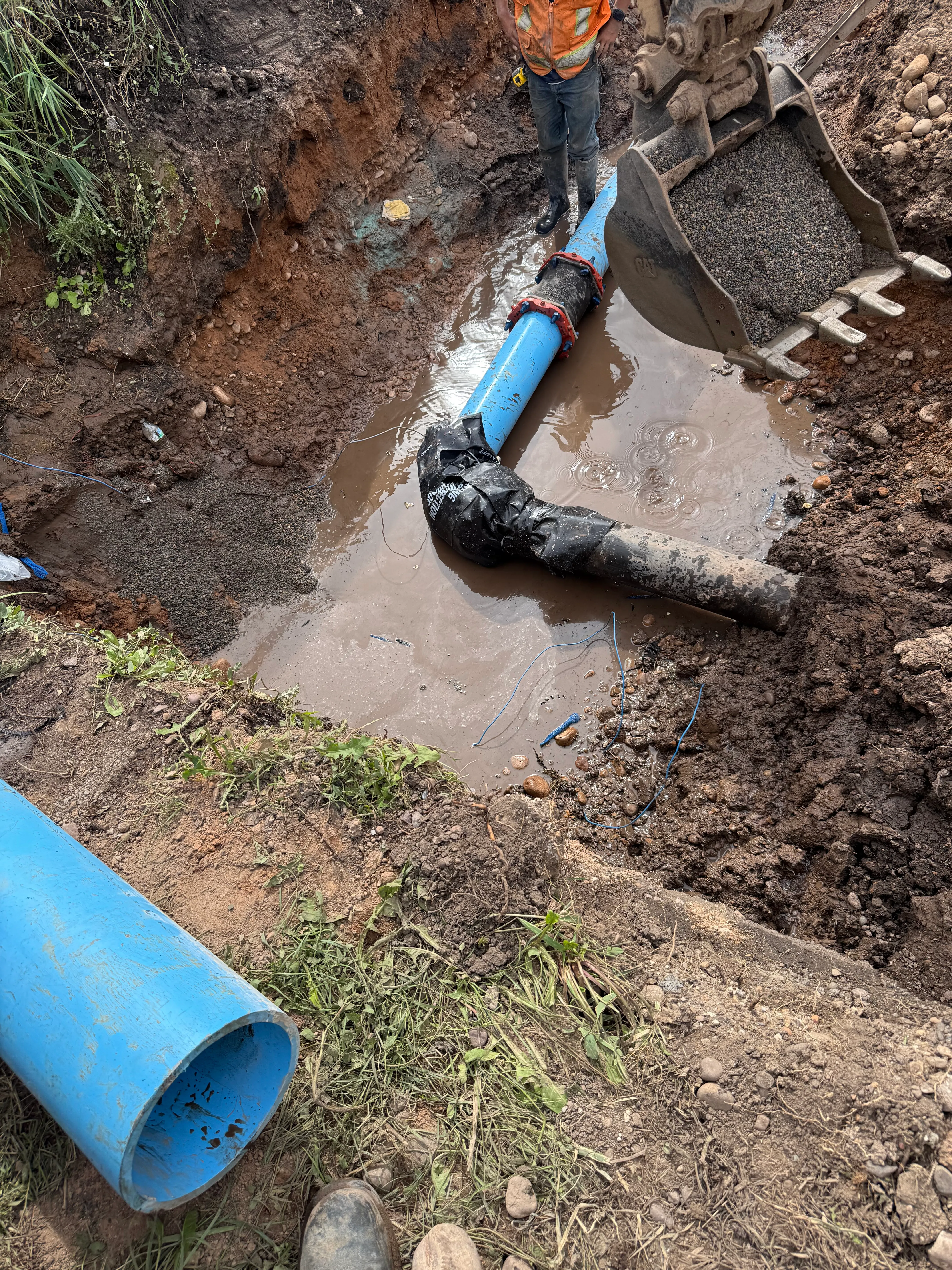 Connecting PVC water line to HDPE water line used in an underground directional bore to cross a roadway in Utah