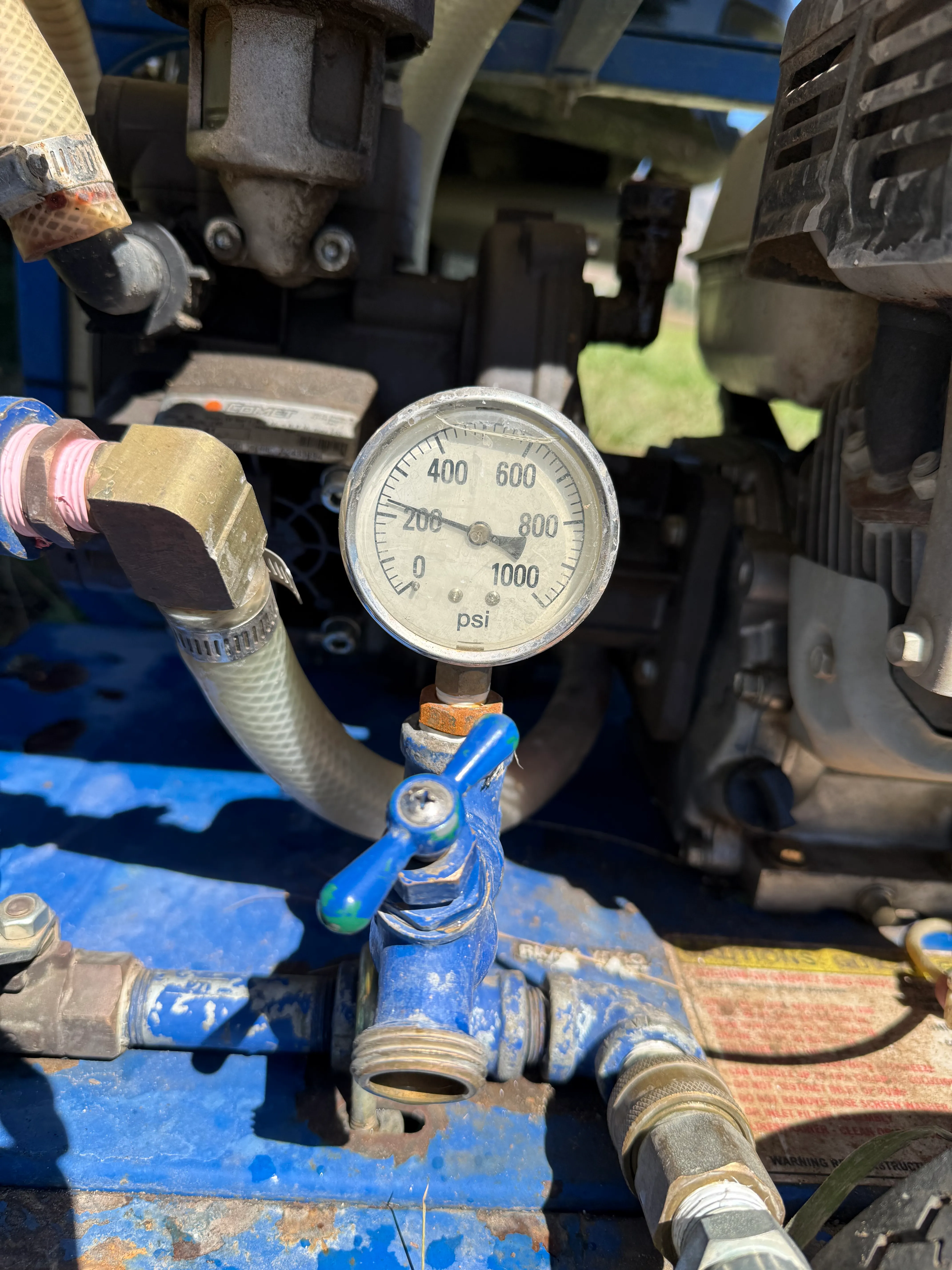 Analog pressure test gauge reading system pressure during water line hydrostatic testing on a Northern Utah jobsite