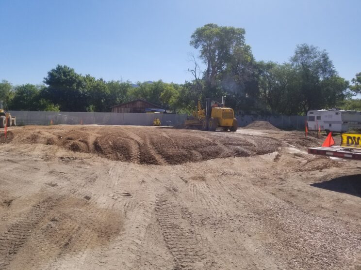 AccuRite Excavation expertly constructing a 6,000 sq foot, 4 ft tall engineered building pad, following strict controlled and tested methods, with documentation adhering to city requirements.
